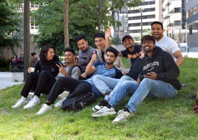 Group of people hanging out on the grass at College Park